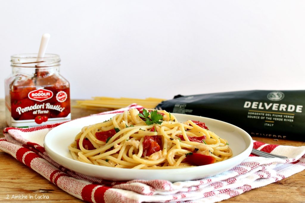 Spaghetti con baccala e pomodori