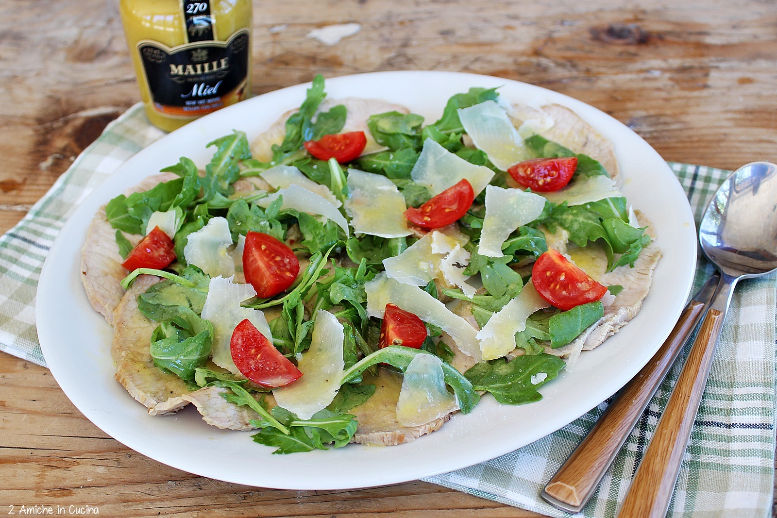 arista alla senape con rucola, parmigiano e pomodorini