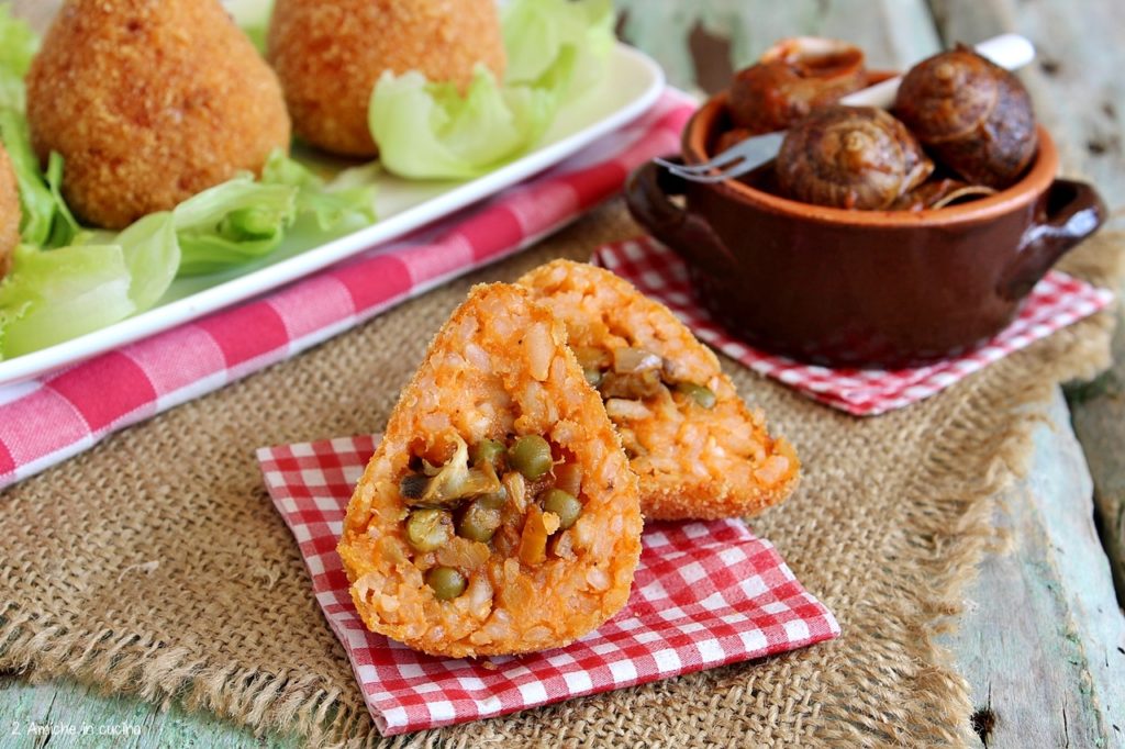 Arancini con lumache ripieni di piselli e carote